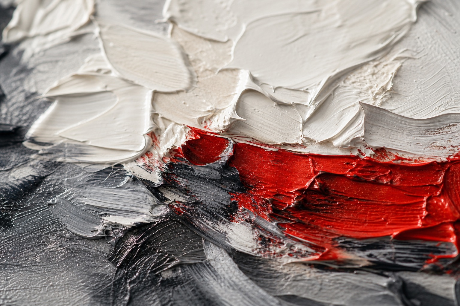 Macro detail of an abstract oil painting with ivory, charcoal and vermilion impasto brushwork