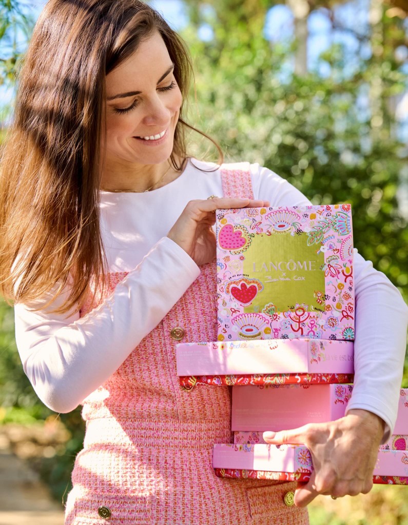 Belgian contemporary artist Barbara Cox with Lancôme x Barbara Cox collaboration boxes
