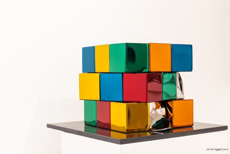 Philippe Gauberti — colourful polished stainless steel Rubik's Cube sculpture in gallery